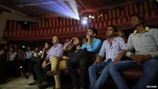 Cinema goers watch Bollywood movie